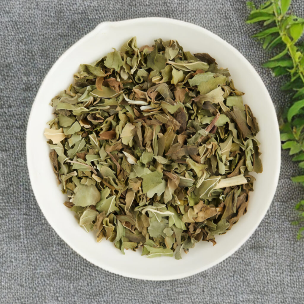 Dried peppermint leaves in a white bowl